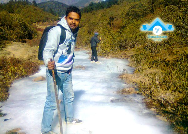 Travelers walking on frozen river
